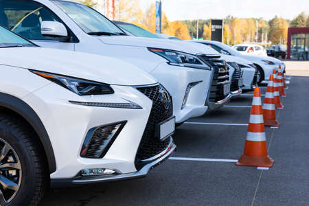 a row of white cars intended for a test drive