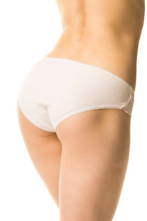 fit girl in panties on a white background, half-length shotの写真素材
