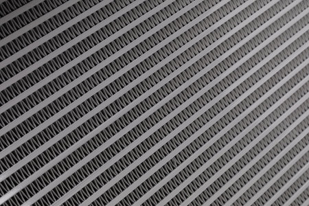 Auto radiator background. Engine cooler background. Vintage style.Grid radiator air conditioning, close-upの写真素材