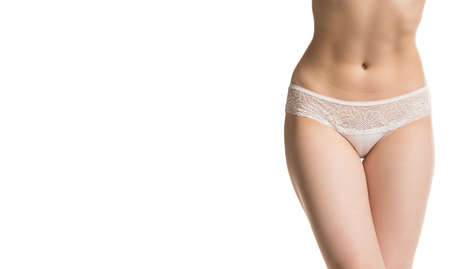girl in panties, half-length shot on white backgroundの写真素材