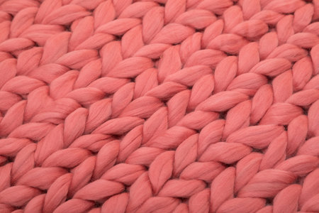 plaid from natural sheep wool close-up coral color