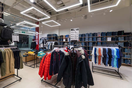 Minsk, Belarus - Nov 25, 2021: Photo of a store of youth, fashionable and stylish clothes with jeans, outerwear, jacket, t-shirt, sweater, hoodie, pants, shirts for men and women in a shopping centerのeditorial素材