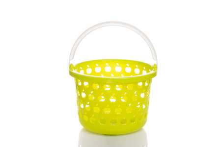 yellow fruit bucket empty on white isolated backgroundの写真素材