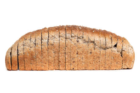 loaf of sliced large grain bread for toast on a white plate close-up