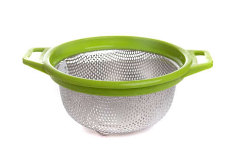 aluminum colander with light green handles on a white isolated background, top viewの写真素材
