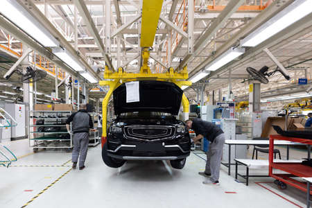 Minsk, Belarus - Dec 15, 2021: Automobile production line. Welding car body. Modern car assembly...