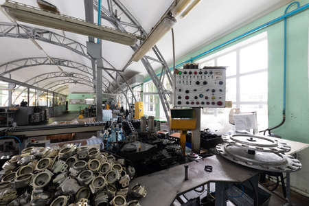 Photo of automobile assembly production. Factory with steel constructions. Plant concept and...