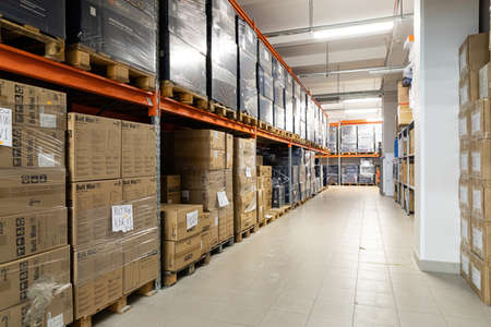 Minsk, Belarus - Jan 05, 2022: Photo of a warehouse with large boxes on the shelves. Utility room of...