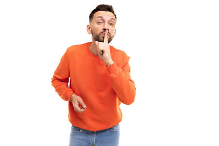 young men a secret interferes with a finger at the lips, the concept of Mystery and SECRET...