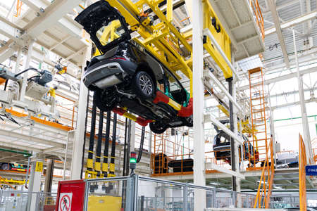 Photo of automobile production line. Welding car body. Modern car assembly plant. Auto industry. Interior of a high-tech factoryの写真素材