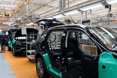 Car bodies are on assembly line. Factory for production of cars. Modern automotive industry. A car...