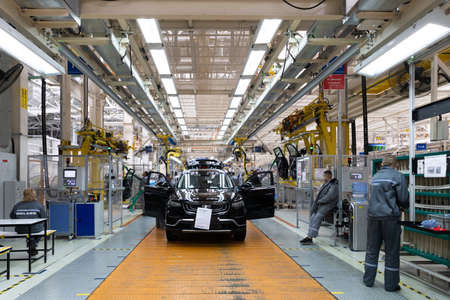 Minsk, Belarus - Dec 15, 2021: Photo of automobile production line. Welding car bodies. Modern car...