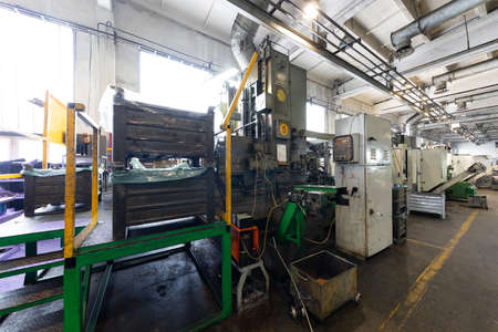 Photo of modern automatic automobile manufacturing workshop. Factory with steel constructions. Plant...