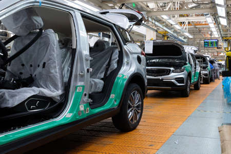 Photo of automobile production line. Welding car bodies. Modern car assembly plant. Auto industryの写真素材