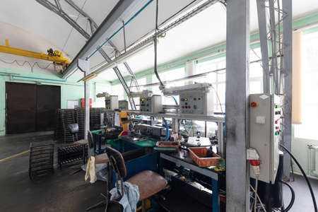 Photo of automobile assembly production. Factory with steel constructions. Plant concept and...