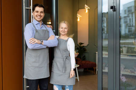 small business owners are happy to greet their customers at the doorstep of their store or...