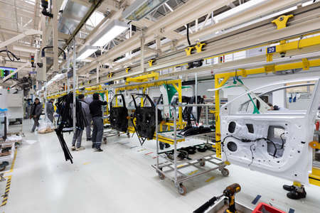 Modern car assembly plant. Auto industry. Interior of a high-tech factory, modern productionの写真素材