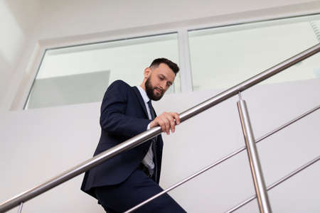 businessman climbs the stairs up, concept of success