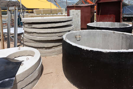Construction site with concrete circles for drainage wells