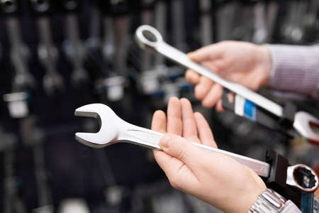 new wrenches close-up in a hardware store against the backdrop of a showcase