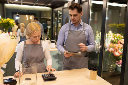 flower shop employees understand accounting before the reporting periodの写真素材