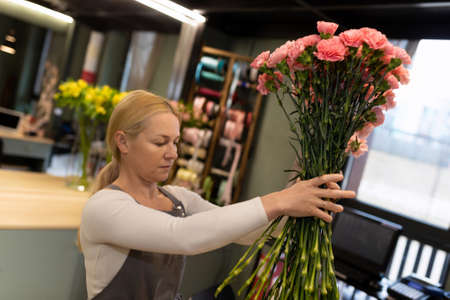 florist collects a bouquet of birthday presentの写真素材