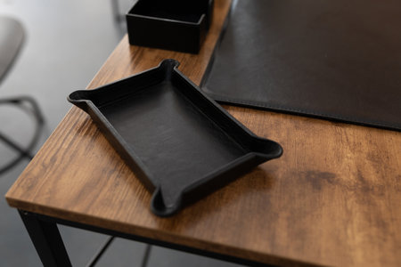 accessory for stationery made of genuine leather on a working wooden table in the officeの写真素材