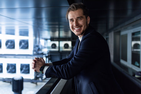 male businessman working as an engineer on the background of refrigeration ventilation air...