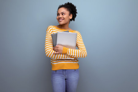 smart afro brunette latin young office woman holding laptop