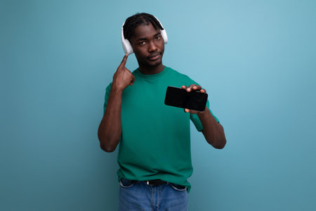 american man with wireless headphones and smartphone mockupの写真素材