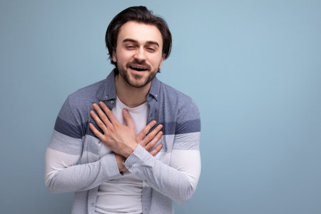 portrait of a well-groomed young brunette man on a studio background