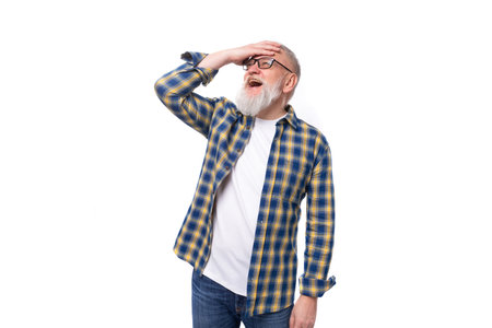 smart 60s middle aged gray-haired retired man with mustache looks awayの写真素材
