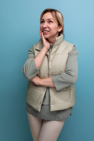 portrait of an inspired european 30 year old woman in comfortable clothes looking dreamilyの写真素材