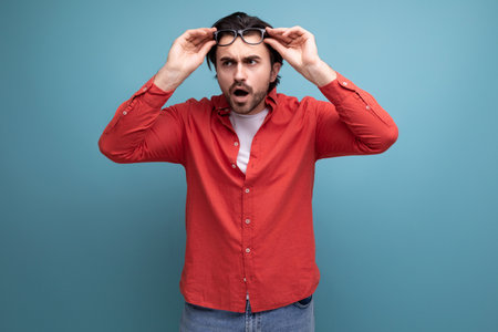 stylish smart european brunette 35 year old man in a shirt thoughtの写真素材