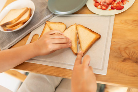 the woman sliced the fried toast into triangles