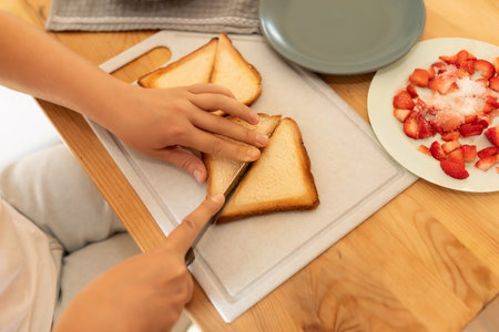 the woman sliced the cooked bread slices into triangles