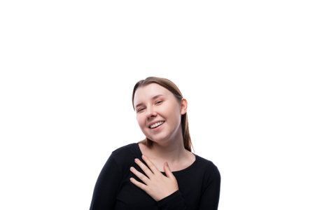 Portrait of a kind European schoolgirl on a white background with copyspace
