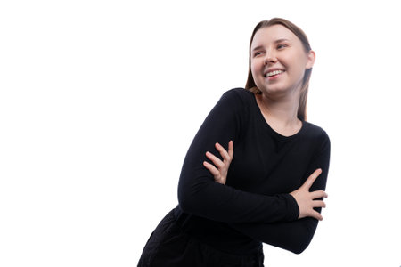 Confident and satisfied pre-teen girl with brown hair on a white background