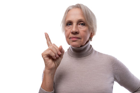 Wise senior woman with gray hair on white background