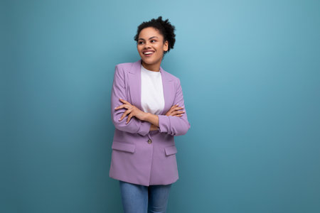 young successful latin business woman dressed in lilac jacket isolated studio background with copy spaceの写真素材
