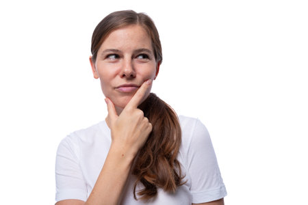 A young woman of European appearance is thoughtful and posing