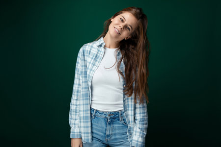 Nice young woman with brown eyes and long healthy hair from nature without dyeingの写真素材