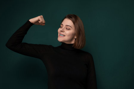 Woman in Black Shirt Poses for Pictureの写真素材