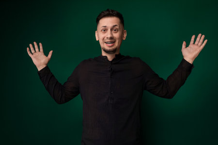 Man Standing in Front of Green Backgroundの写真素材