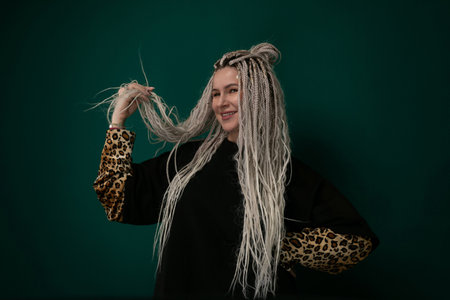 Woman With Long White Hair and Leopard Print Sleeveの写真素材