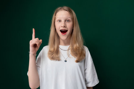 Woman Making Funny Face While Holding Peace Signの写真素材