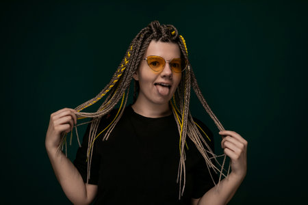 Woman With Dreadlocks Holding Hair in Front of Face