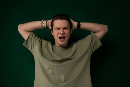 Man Holding Head in Frustration