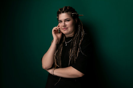 Woman With Dreadlocks Talking on a Cell Phone