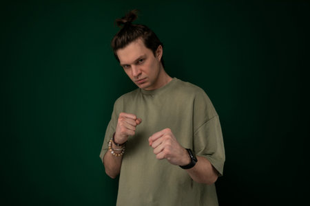 Man Standing in Front of Green Wallの写真素材